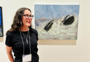 Kathryn Welbourn, a winner in the Senior Visual Art Category, with her oil painting “Gifts of St. Vincent’s,”  at the awards ceremony at The Rooms on April 19, 2024 .